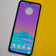 A photo of the Galaxy Z Flip 3 laid out flat on a yellow and speckled background